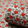 Reverse Silver Leopard Hearts on Red